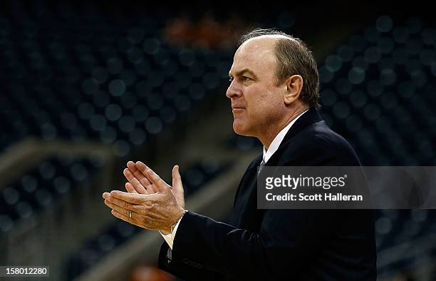 Bruins head coach Ben Howland waits on the court during the game against the Texas Longhorns during the MD Anderson Proton Therapy Showcase at...