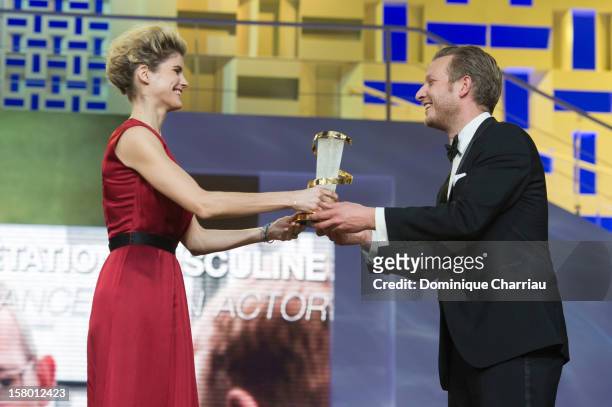 French actress Alice Taglioni gives the jury prize to Danish film director Tobias Lindholm for the film "A Hijacking" during the award ceremony of...
