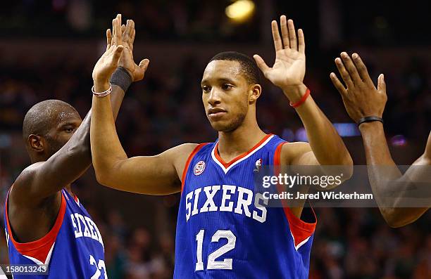 Evan Turner of the Philadelphia 76ers is congratulated by teammates after drawing a foul against the Boston Celtics during the game on December 8,...