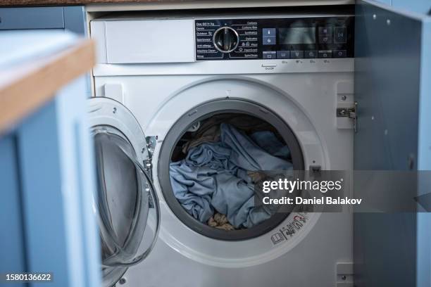 laundry at home in washing machine. - tumble dryer sheets stock pictures, royalty-free photos & images