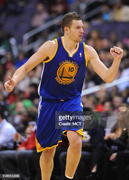 Golden State Warriors power forward David Lee pumps his fist in the direction of the Warriors bench after hitting a shot against the Washington...