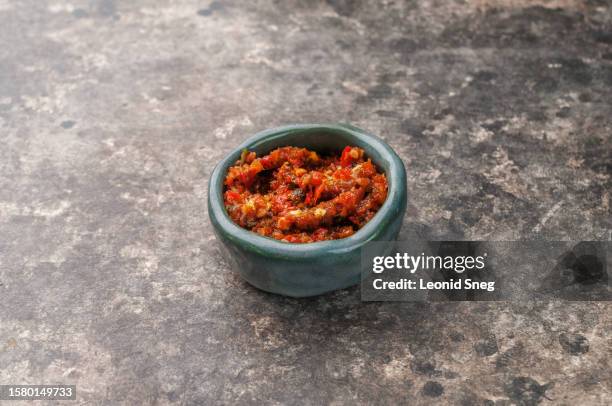 georgian ajika sauce on gray background - bowl chili peppers bildbanksfoton och bilder