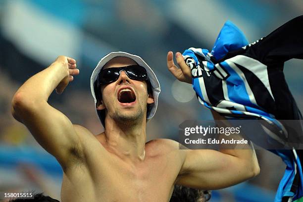 Fans of Gremio cheer their team during a match between Gremio and Hamburgo from Germany as part of the inauguration of Arena stadium on December 08,...