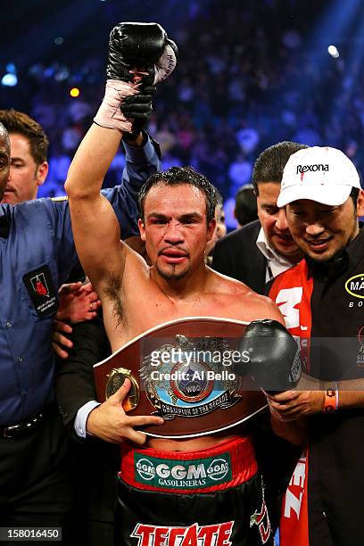 Juan Manuel Marquez celebrates after defeating Manny Pacquiao by a sixth round knockout in their welterweight bout at the MGM Grand Garden Arena on...