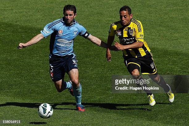 Terry McFlynn of Sydney FC and Leo Bertos of the Phoenix compete for the ball during the round 10 A-League match between Wellington Phoenix and...