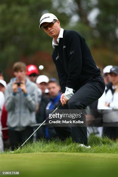 John Senden of Australia plays a chip shot during round four of the 2012 Australian Open at The Lakes Golf Club on December 9, 2012 in Sydney,...