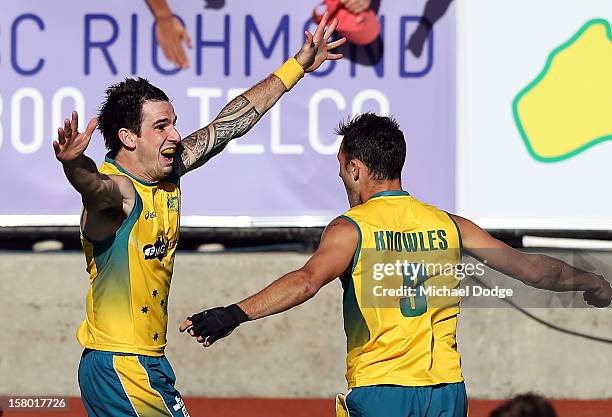 Kieran Govers of Australia celebrates scoring the winning goal in extra time with Mark Knowles to defeat the Netherlands in the final of the 2012...