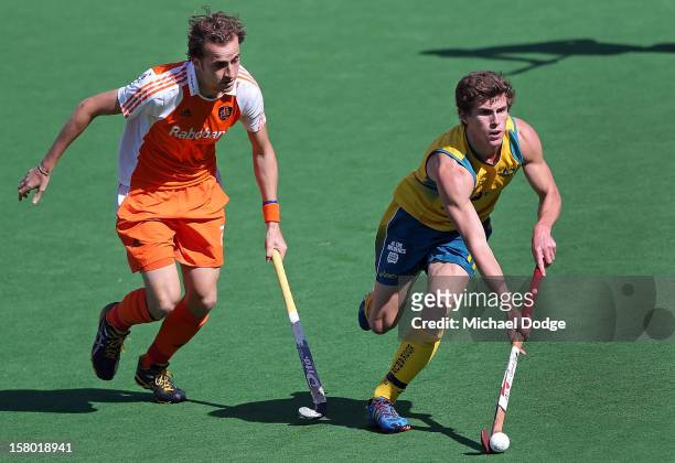 Tristan White of Australia runs with the ball in the final between Australia and the Netherlands of the 2012 Champions Trophy at State Netball Hockey...