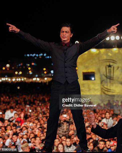 Indian actor Shahrukh Khan poses at Jemaa El Fna place during the Tribute To Hindi Cinema at 12th International Marrakech Film Festival on December...