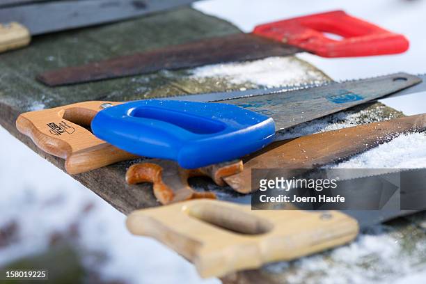 Saws to cut Christmas trees lie on a table in a plantation of Christmas trees in a forest on December 8, 2012 in Fischbach, Germany. Forestry...