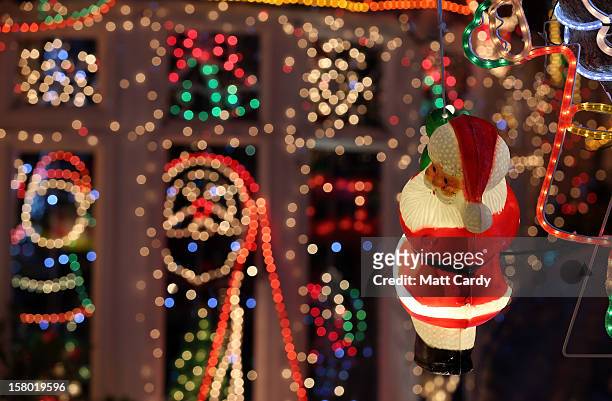 Christmas festive lights adorn a detached house in a suburban street in Melksham, December 8, 2012 in Melksham, England. The lights, a popular...
