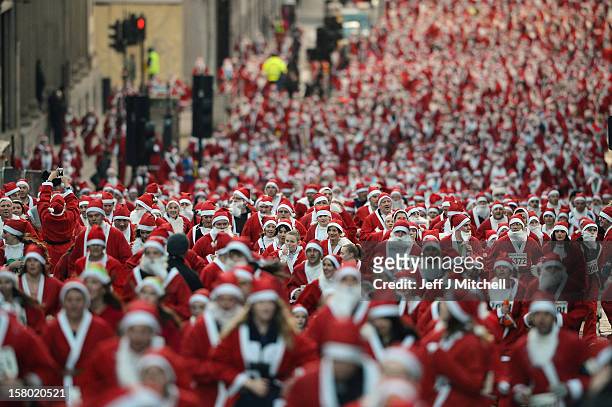 Thousand people take part in the annual Glasgow Santa Dash on November 9, 2012 in Glasgow, Scotland. Members of the public dressed in Santa suits...