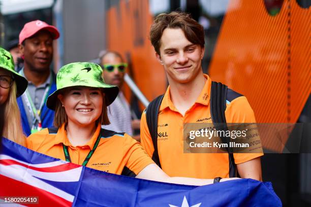 Oscar Piastri of Australia and McLaren F1 poses with a fan during the F1 Grand Prix of Belgium at Circuit de Spa-Francorchamps on July 30, 2023 in...