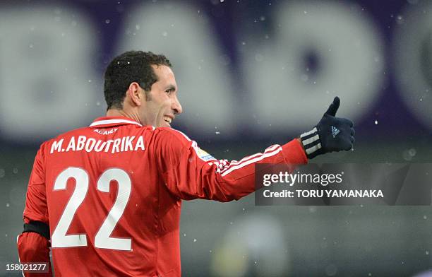 Egypt's Al-Ahly forward Mohamed Aboutrika reacts with joy after scoring a goal against Japan's San Frecce Hiroshima during their 2012 Club World Cup...