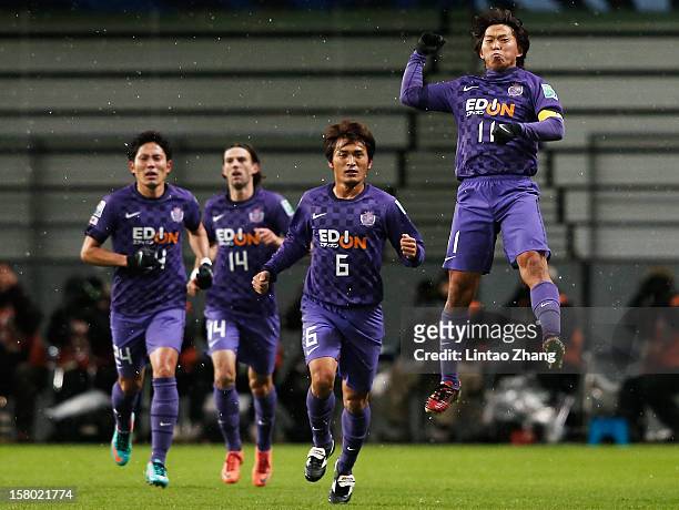 Hisato Sato of Sanfrecce Hiroshima celebrates his first goal with his team mate during the FIFA Club World Cup Quarter Final match between Sanfrecce...