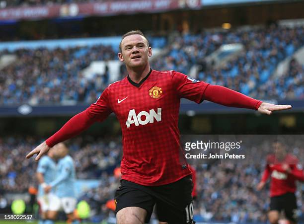 Wayne Rooney of Manchester United celebrates scoring their second goal during the Barclays Premier League match between Manchester City and...