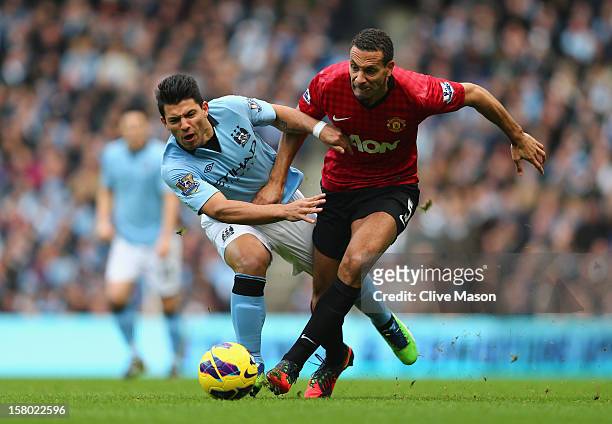 Sergio Aguero of Manchester City tangles with Rio Ferdinand of Manchester United during the Barclays Premier League match between Manchester City and...