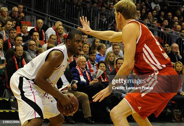 Jan-Hendrik Jagla of Muenchen blocks Patrick Ewing Jr. Of Bonn during the Beko Basketball match between FC Bayern Muenchen and Telekom Baskets Bonn...