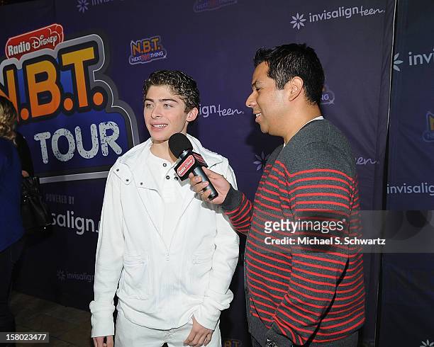 Ryan Ochoa talks with Ernie D. On the red carpet at Radio Disney's N.B.T. 'Next BIG Thing' Season 5 Finale Event at The Americana at Brand on...