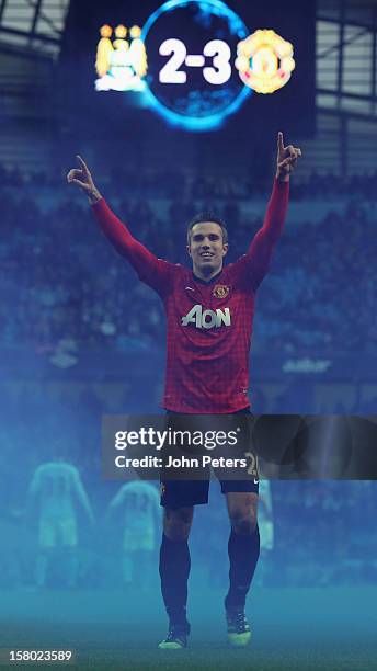 Robin van Persie of Manchester United celebrates at the end of the Barclays Premier League match between Manchester City and Manchester United at...