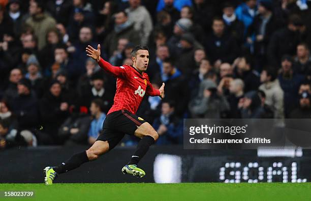 Robin van Persie of Manchester United celebrates scoring the winning goal during the Barclays Premier League match between Manchester City and...