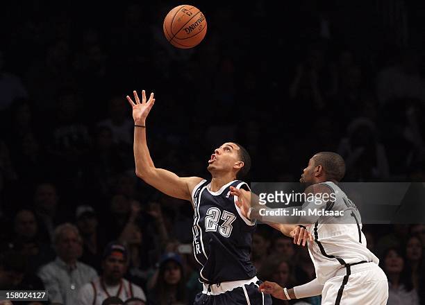 Kevin Martin of the Oklahoma City Thunder in action against C.J. Watson of the Brooklyn Nets at Barclays Center on December 4, 2012 in the Brooklyn...