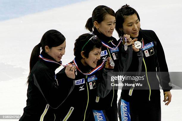 Members of Japanese women's short-track relay team, celebrate after won 2nd Place at ceremony of the Women's 3000m Relay Final during the day two of...