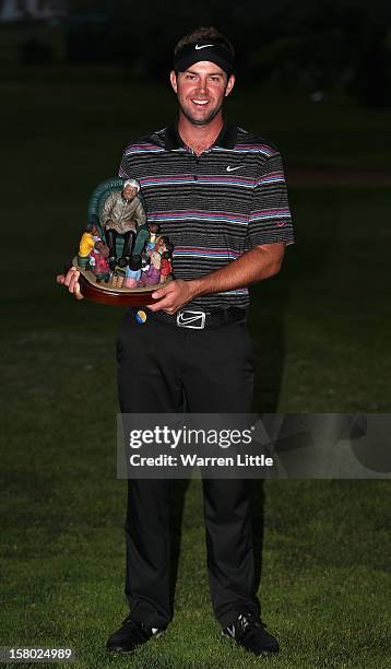 Scott Jamieson of Scotland poses with the trophy after winning The Nelson Mandela Championship presented by ISPS Handa after a three way play-off...