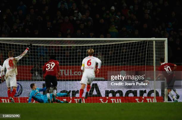 Szabolcs Huszti of Hannover scores his team's first goal during the Bundesliga match between Hannover 96 and Bayer 04 Leverkusen at AWD Arena on...