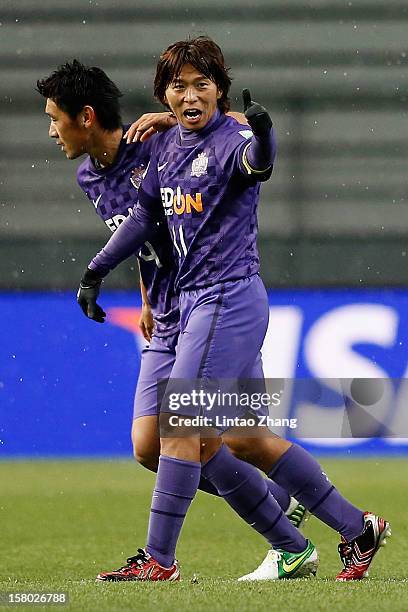 Hisato Sato of Sanfrecce Hiroshima celebrates his first goal with his team mate during the FIFA Club World Cup Quarter Final match between Sanfrecce...