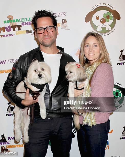 John Littlefield and Nadine Stenovitch attends the Lucky Puppy Rescue and Retail grand opening on December 8, 2012 at Lucky Puppy Rescue in Studio...