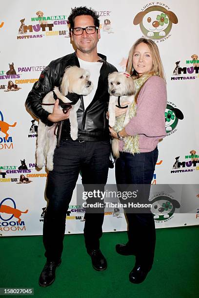 John Littlefield and Nadine Stenovitch attends the Lucky Puppy Rescue and Retail grand opening on December 8, 2012 at Lucky Puppy Rescue in Studio...