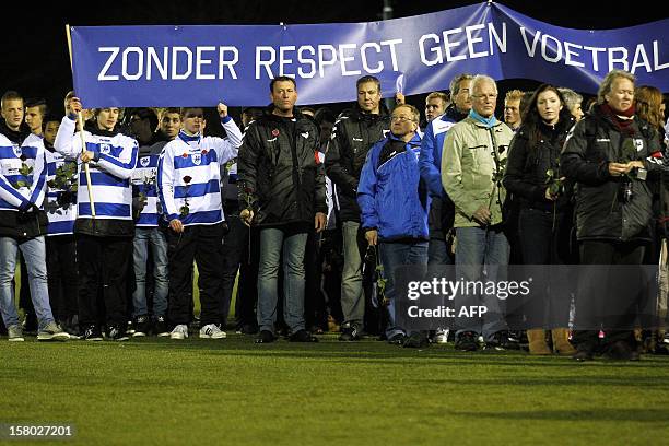 Members of the Dutch football club SC Buitenboys take part in a silent march to pay their respects to their late linesman Richard Nieuwenhuizen in...
