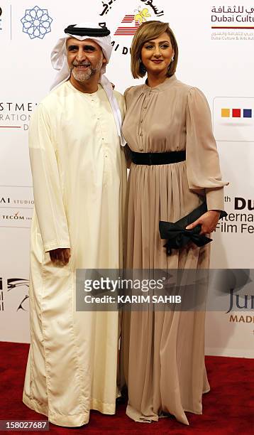 Bahraini actress Haifa Hussein poses for a picture with her husband, fellow actor Habib Ghallum during the Dubai International Film Festival in the...