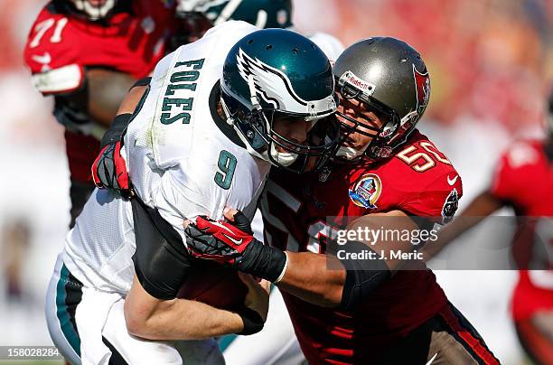 Defensive end Daniel Te'o-Nesheim of the Tampa Bay Buccaneers sacks quarterback Nick Foles of the Philadelphia Eagles during the game at Raymond...