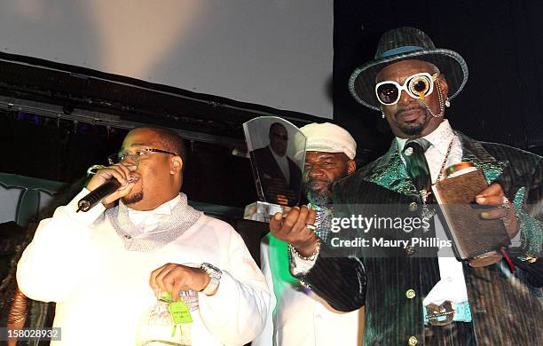 Producer L.T. Hutton receives the lifetime acheivement award from Bishop Don "Magic" Juan during The Official International Players Ball 2012 and...