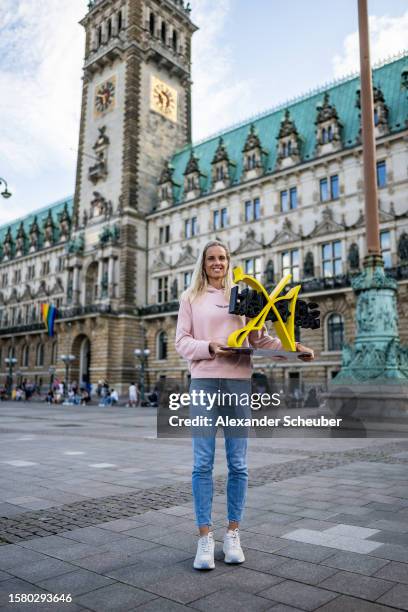 Arantxa Rus of the Netherlands celebrates winning with the trophy during day eight of the Hamburg European Open 2023 at Rothenbaum on July 29, 2023...