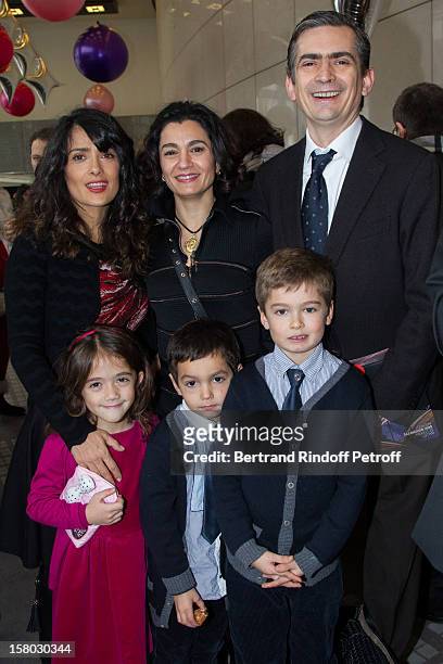 Salma Hayek and her daughter Valentina Paloma Pinault pose with Mexico's Ambassador to the OECD Agustin Garcia Lopez and family before the Don...