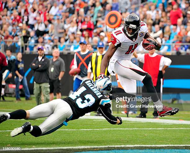 Julio Jones of the Atlanta Falcons scores a touchdown against Haruki Nakamura of the Carolina Panthers during play at Bank of America Stadium on...