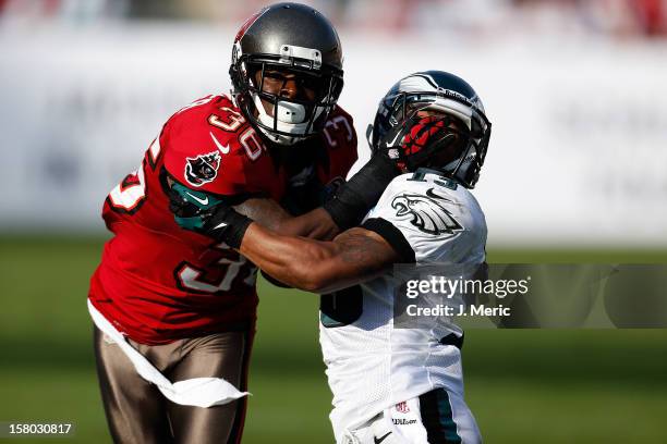 Defender Danny Gorrer of the Tampa Bay Buccaneers fights for postion with receiver Damaris Johnson of the Philadelphia Eagles during the game at...