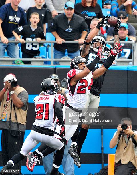 Steve Smith of the Carolina Panthers makes a catch in the end zone over defender Chris Hope of the Atlanta Falcons but is ruled out-of-bounds during...