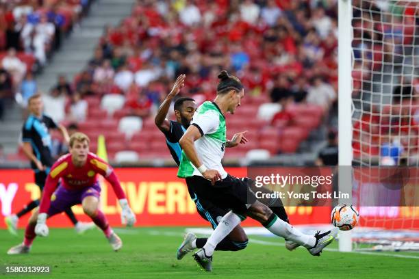 Darwin Nunez of Liverpool scores his team's first goal past Ricardo Pereira of Leicester City during the first half of the pre-season friendly at the...