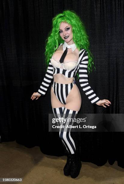 Ashlynne Dae dressed as Beetlejuice attends the 2023 Midsummer Scream held at Long Beach Convention & Entertainment Center on July 29, 2023 in Long...