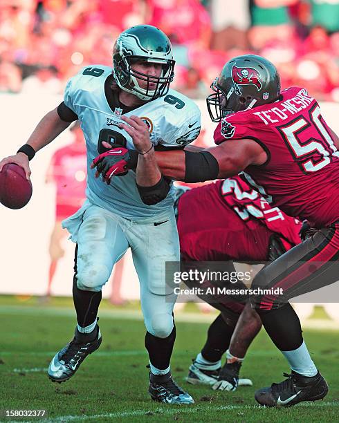 Quarterback Nick Foles of the Philadelphia Eagles runs away from linebacker Daniel Te'o-Nesheim of the Tampa Bay Buccaneers December 9, 2012 at...