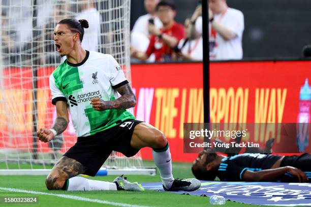 Darwin Nunez of Liverpool celebrates after scoring his team's first goal past Ricardo Pereira of Leicester City during the first half of the...