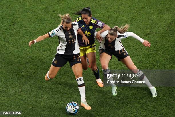 Lady Andrade of Colombia battles for the ball Klara Buehl and Jule Brand of Germany during the FIFA Women's World Cup Australia & New Zealand 2023...