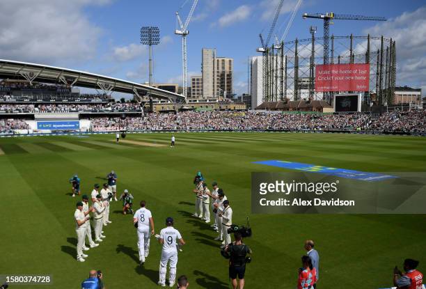 Stuart Broad of England is given a guard of honour by the Australia team as he takes to the field during Day Four of the LV= Insurance Ashes 5th Test...