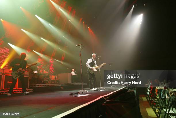 Rick Parfitt, Matt Letley, Andrew Bown, Francis Rossi and John Edwards of Status Quo perform at Quofestive at the BIC on December 9, 2012 in...