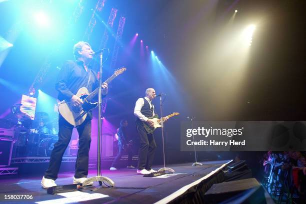 Matt Letley, Rick Parfitt, Francis Rossi and John Edwards of Status Quo perform at Quofestive at the BIC on December 9, 2012 in Bournemouth, England.