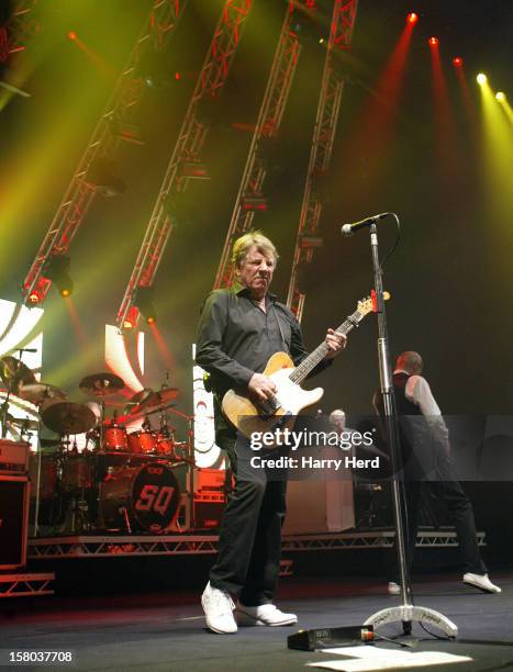 Rick Parfitt, Andrew Bown and Francis Rossi of Status Quo perform at Quofestive at the BIC on December 9, 2012 in Bournemouth, England.